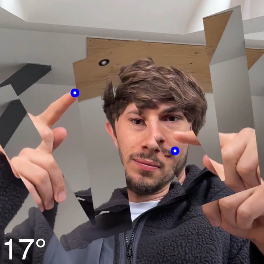 I am tracking my index fingers. When they slightly rotate the webcam also rotates and reveals the letter W.