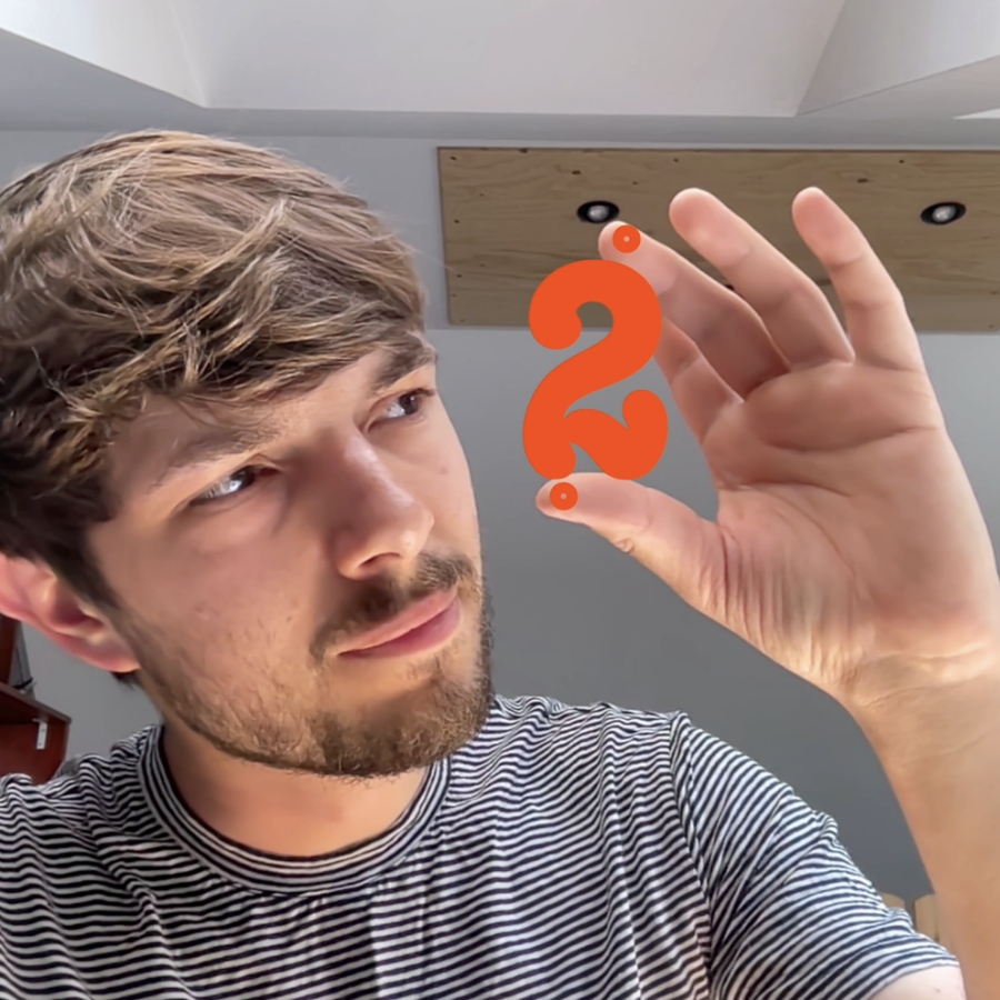 I am scaling letters between my fingers. The letters are drawn on an augmented reality layer and look like they are sitting between my thumb and index finger.