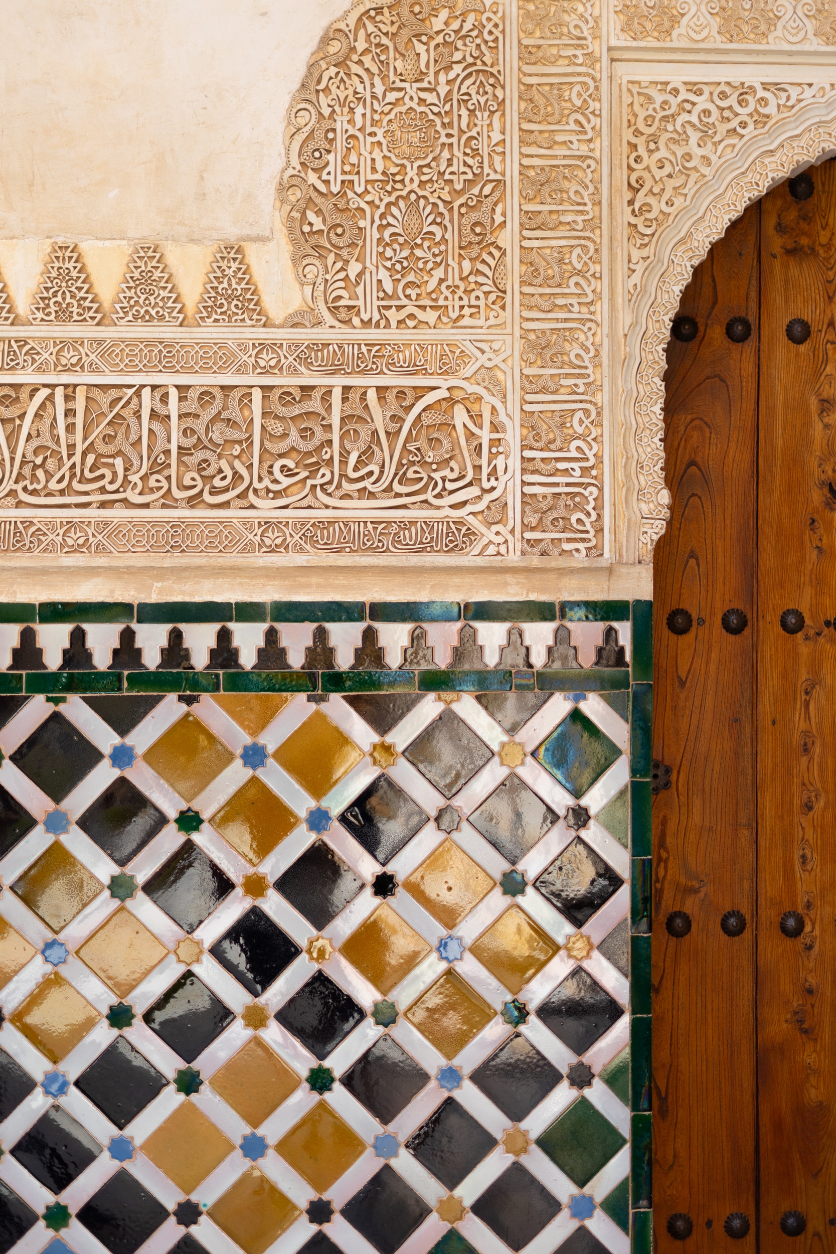 Bright colorful painted tiles of the Alhambra in Andalusia.